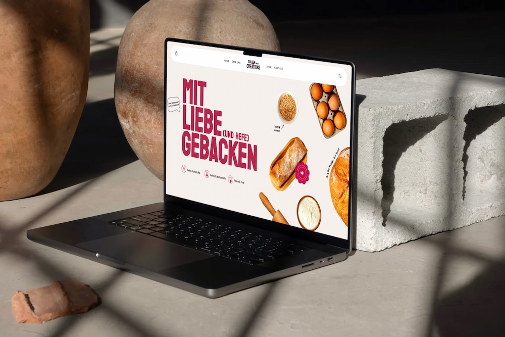 Bäckerei Homepage mit verschiedenen Gebäck präsentiert auf einem Laptop